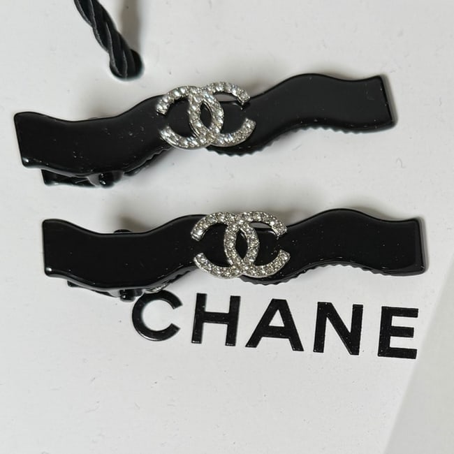 CHANEL 2Pc Black/Rhinestone CC Long Zig Zag Hair Clips & Gift Bag: • CHANEL • L.A. Collection • Gabrielle • 2Pc Set • Black • Lg Hair Clips • Shape: Long Zig Zag • White Rhinestone CC Logo • Black Tone Hardware