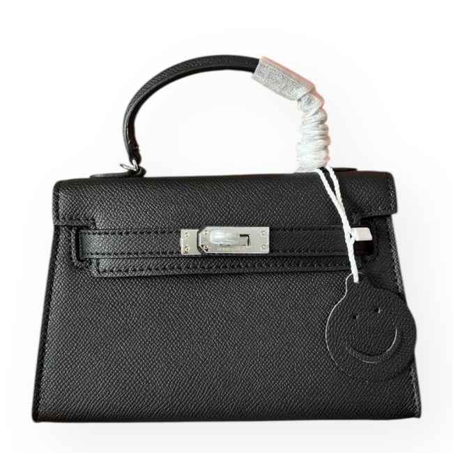 Hermes Black/Silver Mini Kelly Birkin Beaute Bag & Original Box: • Hermes • Kelly • Black • Silver Tone Hardware • Signature Front Twist Lock Closure • Removable Shoulder Strap Included • Top Handle Or Shoulder Carry • Interi