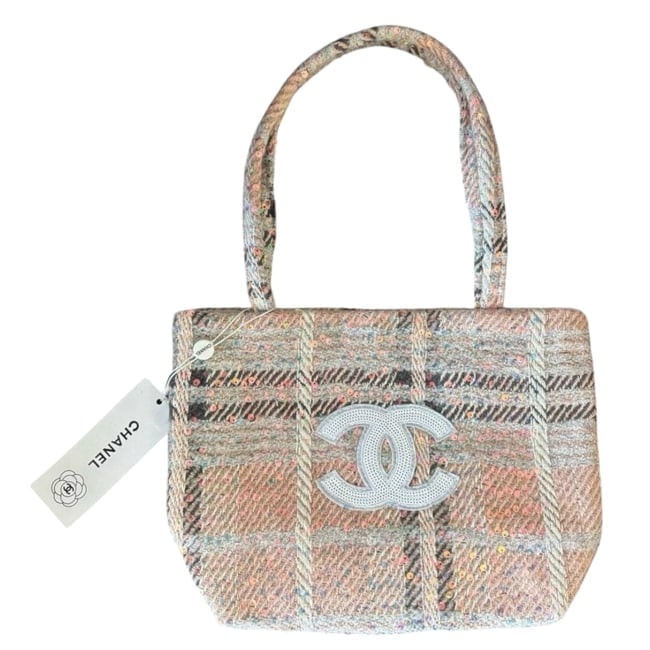 CHANEL Coral Pink Tweed Detailed Logo U.L Tote: • Chanel • Tote • Coral Pink • Tweed • Detailed Front CC • Double Handles • Uniform Line • Snap Closure • 12.6" x 8.7" (in) • Makeup/Diff