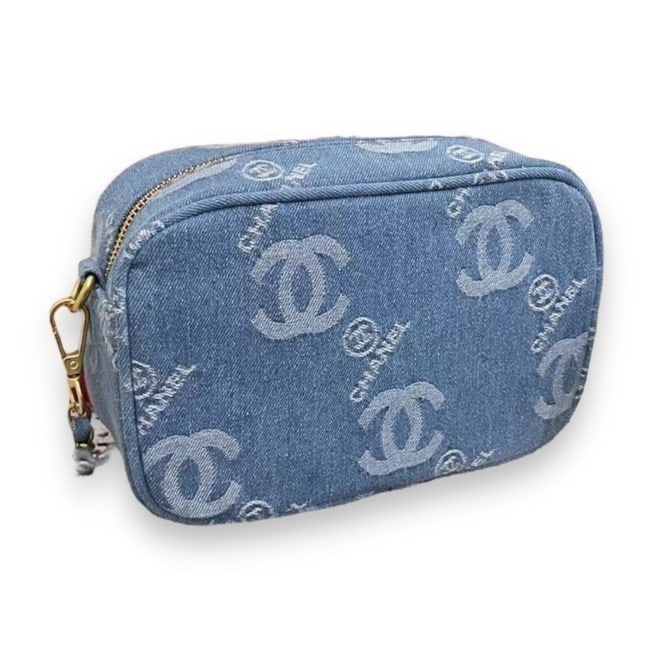 CHANEL Blue Denim Cross Body Beaute Bag: • CHANEL • Blue Denim • Certificate Of Authenticity Included • Cross Body Beaute Bag • Gold Tone Hardware • Zip Closure • Removable Shoulder Strap • Comes In Or