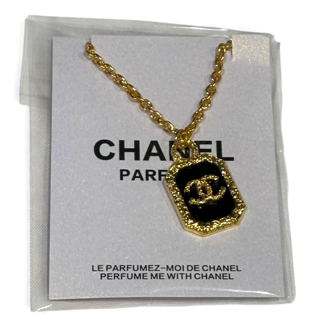 CHANEL Gold/Black CC logo Beaute Necklace & Original Gift Bag: • CHANEL • Necklace • Adjustable • Gabrielle • L.A Collection • Detailed Gold Tone Hardware • Black Accents • CC Logo • Box Included • Or