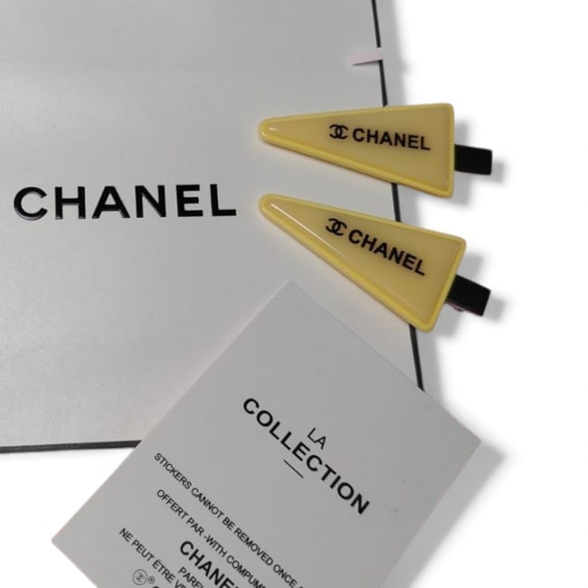 CHANEL 2Pc Yellow/Black CC Triangle Beaute Hair Clips & Original Gift Bag: • CHANEL • 2Pc Set • Gabrielle • Hair Clips • Yellow • Black Accents • Top Logo • Silver Tone Hardware • Shape: Lg Triangle • L.A Collection • O