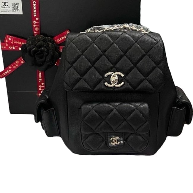 CHANEL Black/Gold Quilted 23K Duma Tank Beaute Backpack & Original Box: • CHANEL • Black • 23K Tank • Duma Backpack • Quilted Pattern • Gold Tone Hardware • Front CC Logo Exterior Pocket • Signature CC Twist Lock Closure • Fron