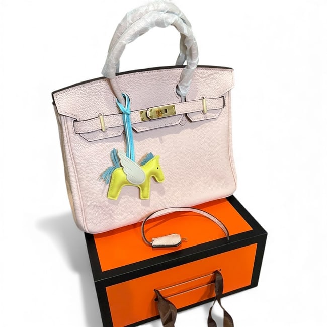 Hermes Powder Pink/Gold Birkin Beaute Bag, Lock/Key & Original Gift Bag: • Hermes • Birkin Bag • Powder Pink • Top Handle Or Shoulder Carry • Removable Straps Included • Signature Front Twist Closure • Interior Slip Pocket • Gold Ton