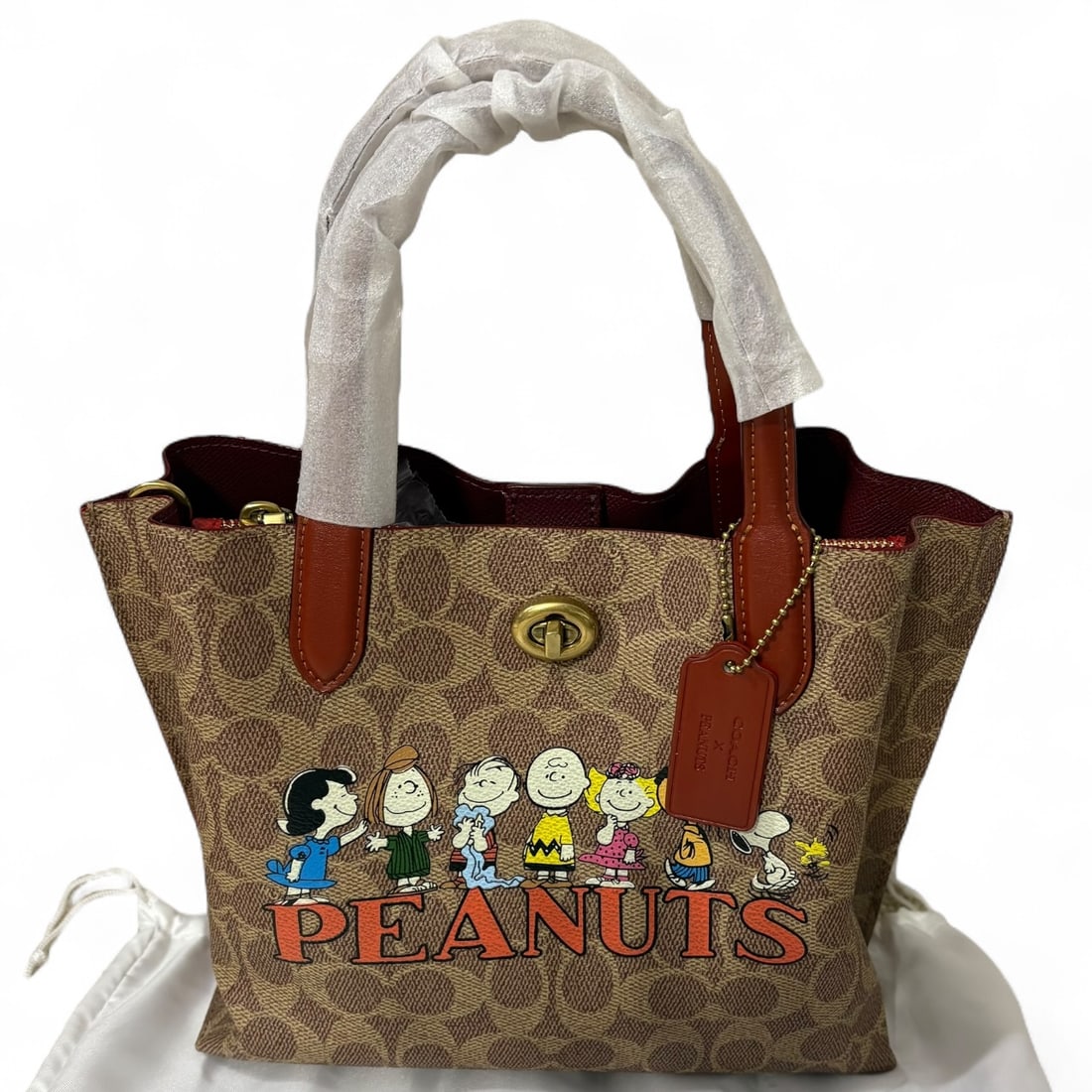 Coach X Peanuts 75th Anniversary Willow 24 Tote Beaute Bag: • Coach • Willow 24 Tote • Peanuts Collaboration • Certificate Of Authenticity Included • Signature Pattern • Removable Strap • Gold Tone Hardware • Top Handles