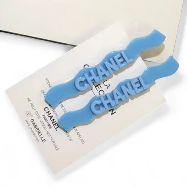 CHANEL 2Pc Blue CHANEL Logo Long ZigZag Hair Clips & Gift Bag: • CHANEL • Gabrielle • Hair Clips • 2Pc Set • Blue • CHANEL Logo • Shape: Long ZigZag • Gold Tone Hardware • L.A Collection • Unopened/In Original