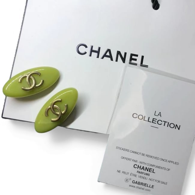 CHANEL 2Pc Lg Green/Gold CC Oval Beaute Hair Clips & Gift Bag: • CHANEL • Gabrielle • Hair Clips • 2Pc Set • Green • Gold Accents • CC Logo • Shape: Lg Oval • L.A Collection • Unopened/In Original Packaging