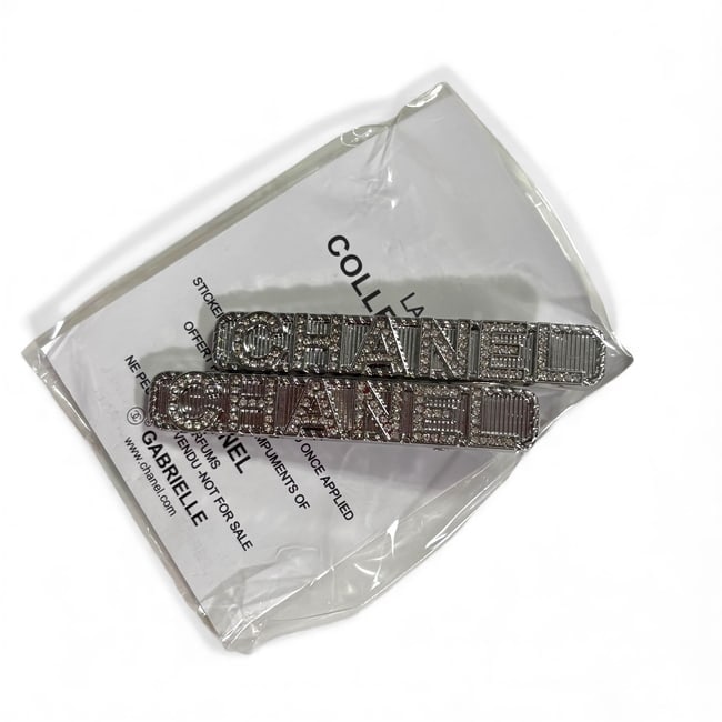 CHANEL 2Pc Set Silver/Rhinestone Logo Long Rectangle Hair Clips & Gift Bag: • CHANEL • 2Pc Set • Gabrielle • Hair Clips • Shape: Long Rounded Rectangle • White Rhinestone CHANEL Logo • Silver Tone Hardware • L.A Collection • Unopen