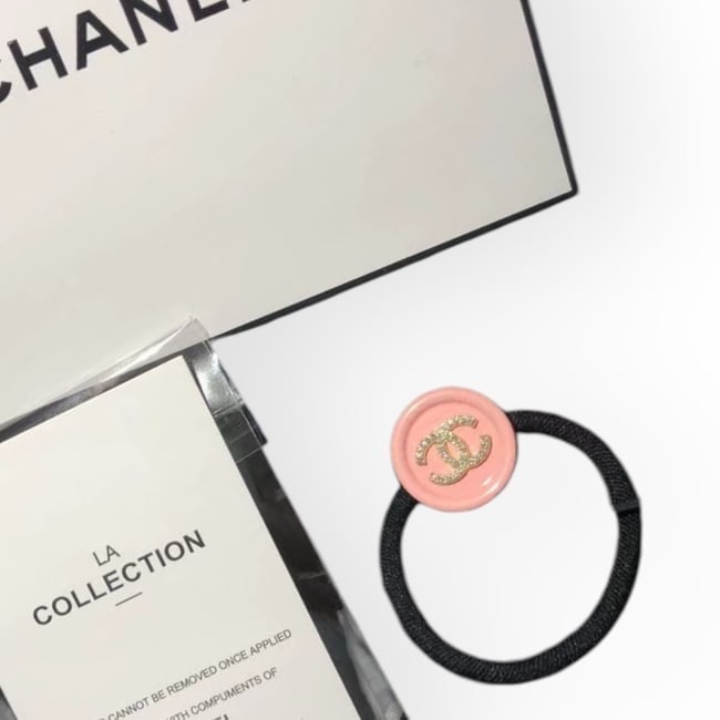 CHANEL Pink/White Rhinestone CC Round Hair Tie & Original Gift Bag: • CHANEL • L.A. Collection • Gabrielle • Hair Tie • Pink • White Rhinestone CC Logo • Tie Color: Black • Shape: Round • Unopened/In Original Packaging