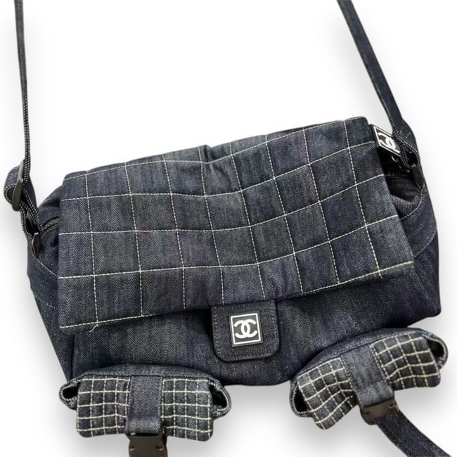 CHANEL LG Quilted Black Denim Double Pocket Messenger Beaute Bag: • CHANEL • Quilted Pattern • Black Denim • Double Pocket Messenger Bag • Single Adjustable Strap • Front Logo • Dual Front Pockets • Zip Closure • Secondar