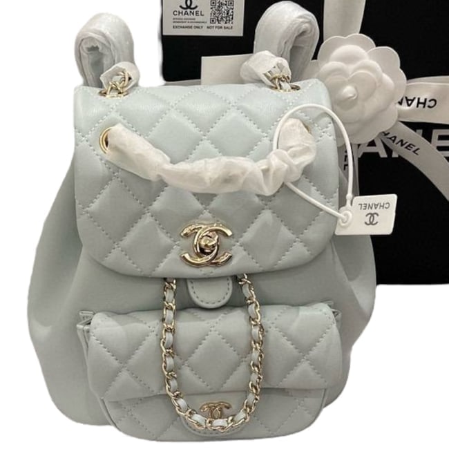 CHANEL Grey/Silver Quilted Mini Duma Beaute Backpack & Original Box: • CHANEL • Grey • Duma Backpack • Quilted Pattern • Silver Tone Hardware • Front CC Logo Exterior Pocket • Signature CC Twist Lock Closure • Front Exterior Snap