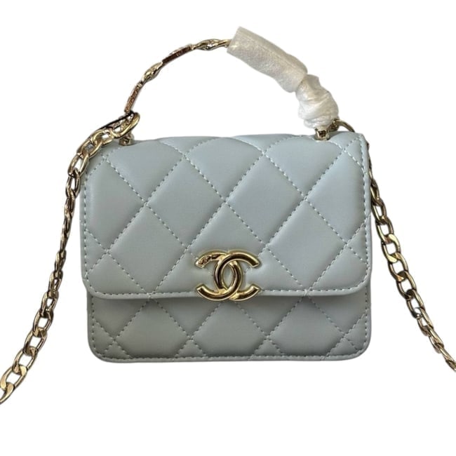 CHANEL Baby Blue Quilted Mini 2Way Carry Beaute Bag & Original Box: • CHANEL • Baby Blue • Quilted Pattern • Single Chain Link Strap • Silver Tone Hardware • Chain Link COCO Logo Top Handle • Front CC Logo • Magnetic Snap Closur