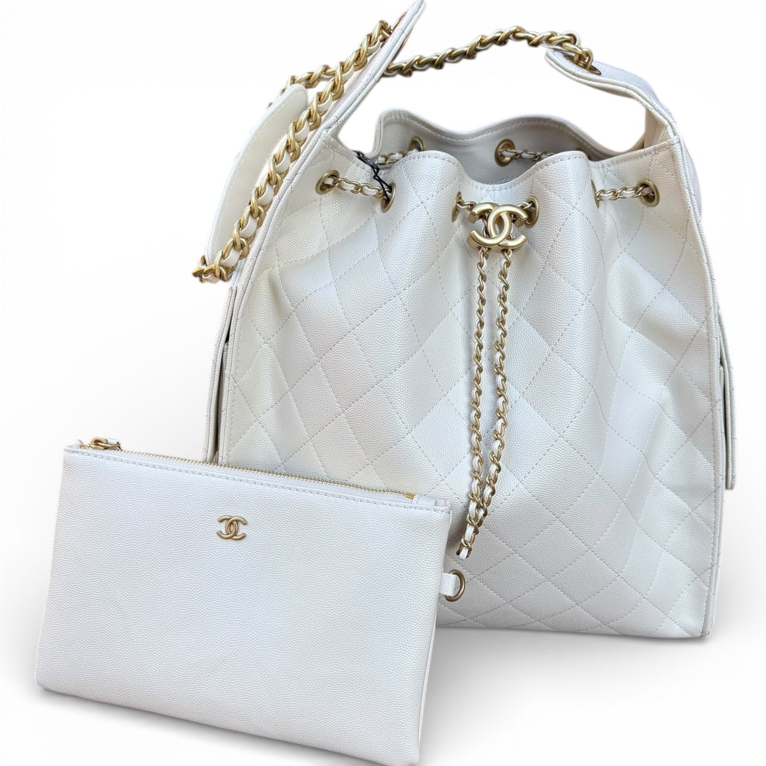 CHANEL White Quilted Tall Hobo Bucket Beaute Bag & Gift Bag: • CHANEL • Hobo Bucket Bag • White • Gold Tone Hardware • Quilted Pattern • Tall • Chunky Intertwined Leather Chain Strap • Interior Slip Pocket • Re