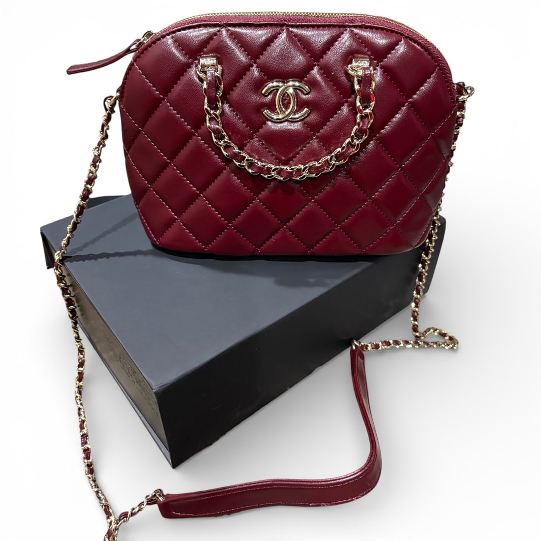 CHANEL Deep Red Patent Quilted Mini Clutch With Chain Beaute Bag & Original Box: • CHANEL • Shell Clutch • Deep Red • Gold Tone Hardware • Quilted Patent Pattern • Single Intertwined Leather Chain Strap • Shoulder Carry • Top Handle For Opti