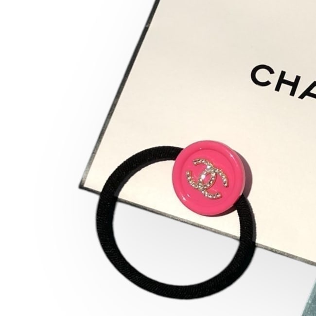 CHANEL Hot Pink/Rhinestone CC Round Gabrielle Hair Tie & Gift Bag: • CHANEL • Gabrielle • L.A Collection • Hair Tie • Hot Pink • Shape: Round • White Rhinestone CC Logo • Tie Color: Black • Original Gift Bag Included