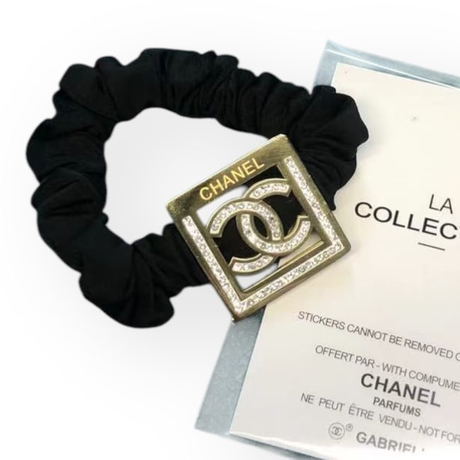 CHANEL Gold/Rhinestone Accented Square Scrunchy & Original Gift Bag: • CHANEL • Gabrielle • Scrunchy/Hair Tie • Gold • White Rhinestone CC Logo • CHANEL Logo • White Rhinestone Accents • Black Scrunchy • Shape: Square &b