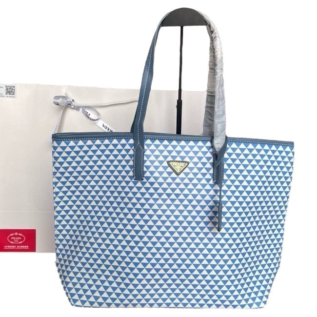 Prada Blue/White Lg Symbole Beaute Tote & Original Gift Bag: • Prada • Tote • Lg • White • Blue Accents • Double Handles • Symbole • Interior Zip Pocket • Arm Or Shoulder Carry • Original Gift Bag Included