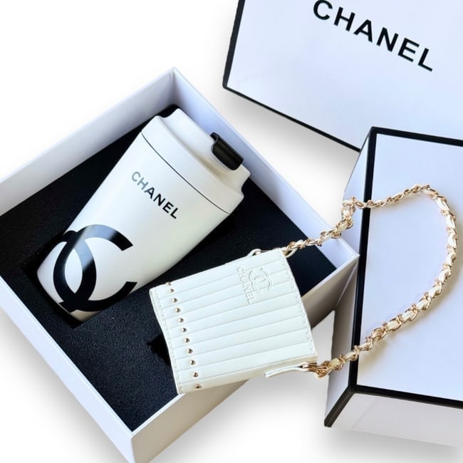 CHANEL 2Pc Gift Set White/Black Coffee Mug & Sleeve W/ Original Box: • CHANEL • Collectors Piece • Gift Set • White Coffee Mug • Black CC Logo • Matching Removable Mug Sleeve Included • Gold Tone Hardware • Intertwined Leather Ch