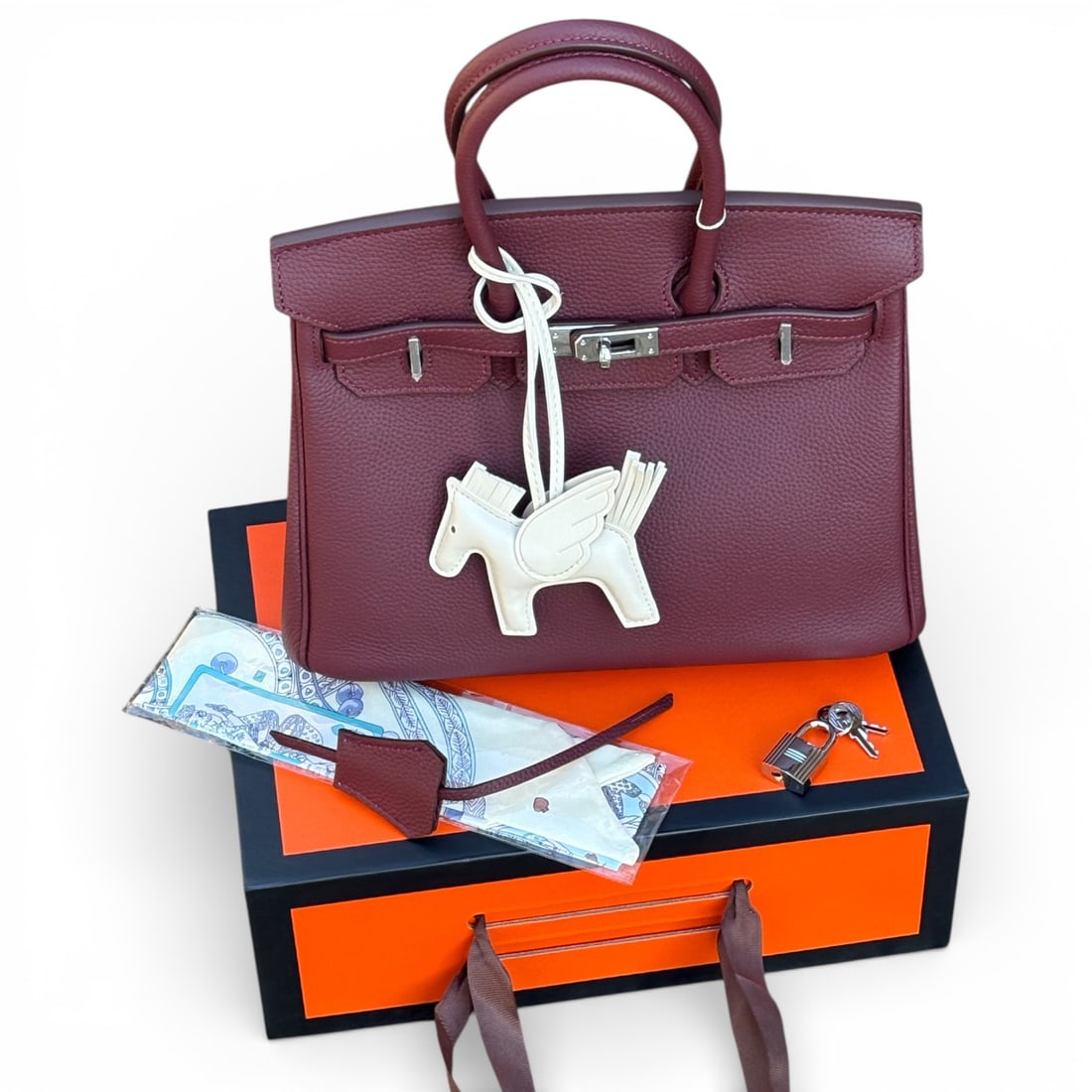 Hermes Berry/Silver Birkin Beaute Bag, Keys, & Original Box: • Hermes • Berry • Top Handle Or Shoulder Carry • Birkin Bag • Signature Front Twist Closure • Silver Tone Hardware • Zip Closure On Sides • Interior Slip Pocke