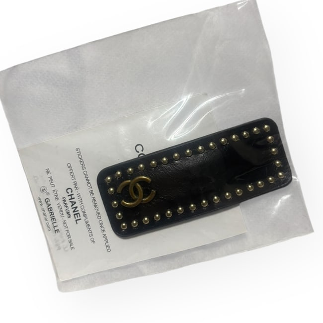 CHANEL XL Black/Gold Studded Hair Clip & Gift Bag: •• CHANEL • Type: Hair Clip • Style: Gabrielle • Collection: L.A Collection • Color: Black • Feature: Side Logo • Detail: Studded Detail • Hardware: Gold T