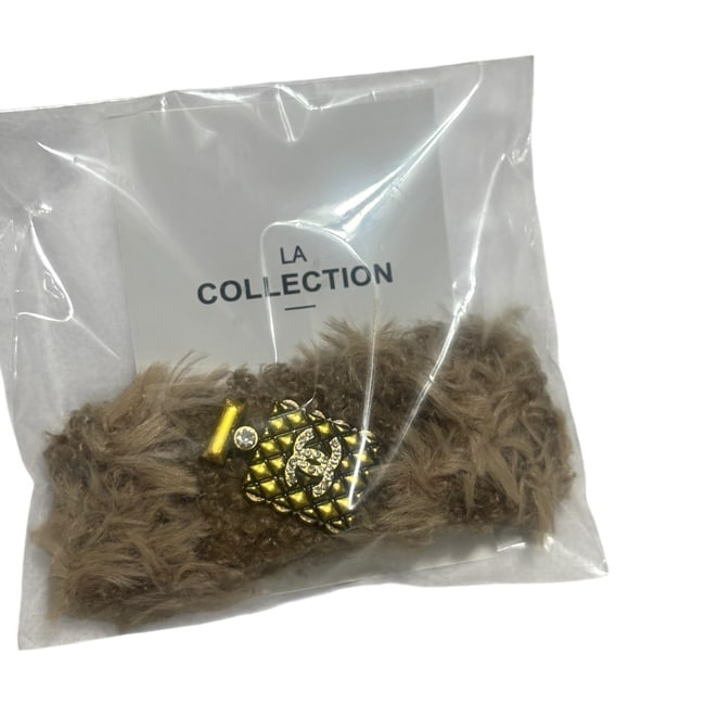 CHANEL LG Fur/Gold Rhinestone CC Hair Clip & Gift Bag: • CHANEL • Type: Hair Clip • Style: Gabrielle • Collection: L.A Collection • Color: Brown Fur • Shape: Large Long Oval • Size: Large • Detail: Perfume Bottle De