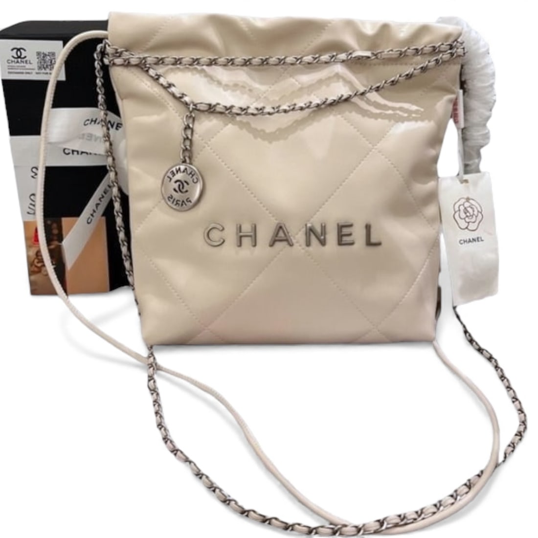 CHANEL Quilted White & 22 Hobo Beaute Bag & Matching Pouch: • CHANEL • Quilted Pattern • White • Shiny Bucket Bag • Matching CHANEL Pouch Included • Silver Tone Hardware • Snap Closure • Intertwined Leather Chain Strap &