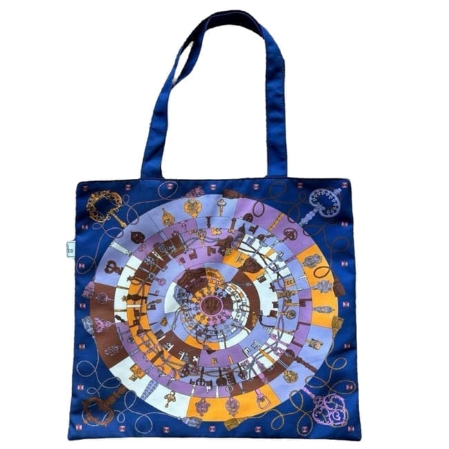Hermes Royal Blue/Purple Multicolor Signature Print U.L Tote: • Hermes • Type: Tote • Color: Royal Blue/Purple Multicolor • Print: Signature Print • Interior: Signature Orange Interior • Material: Canvas • Handles: Double Handl
