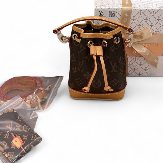 Louis Vuitton Brown Monogram Nano Noe Beaute BB & Original Box: • Louis Vuitton • Nano Noe" • Bucket Bag • Brown • Monogram Pattern • Gold Tone Hardware • Removable Strap Included • Removable Top Handle For Optional Carry &b