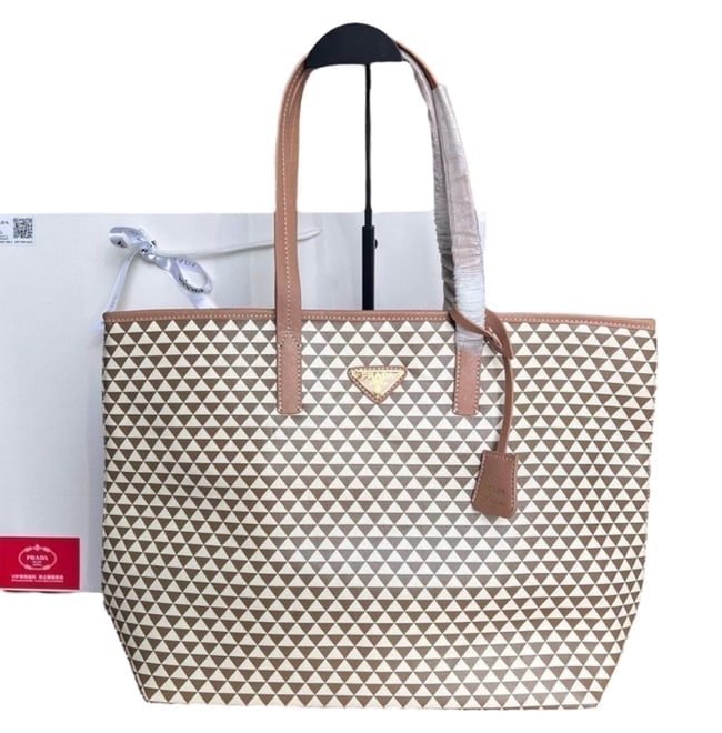 Prada Brown/White Lg Symbole Beaute Tote & Original Gift Bag: • Prada • Tote • Lg • Double Handles • Symbole • Interior Zip Pocket • Arm Or Shoulder Carry • Original Gift Bag Included • Front Logo • Gold Tone