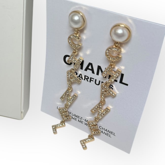CHANEL Earrings Pearl/Rhinestone Logo Drop Earrngs & Original Gift Bag: • CHANEL • Earrings • Style: Drop • Gold Tone Hardware • Pearl Accent • Rhinestone CHANEL Logo • Gabrielle • L.A. Collection • Original Gift Bag Included