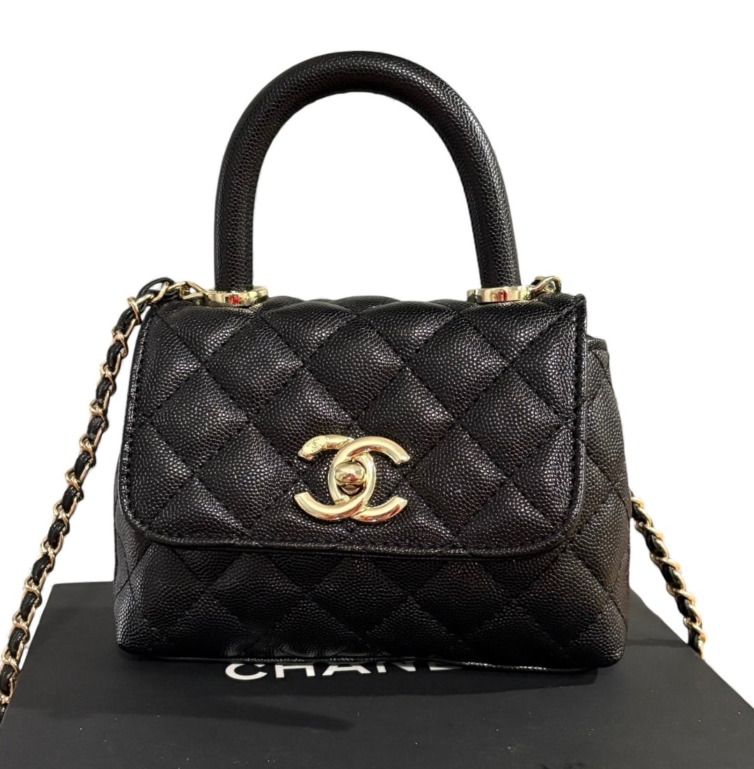 CHANEL Black/Gold Quilted CoCo Top Handle Beaute Bag & Original Box: • CHANEL • Black • Quilted Pattern • Gold Tone Hardware • Signature Front CC Logo Twist Lock Closure • Top Handle For Optional Carry • Intertwined Leather Chain Stra