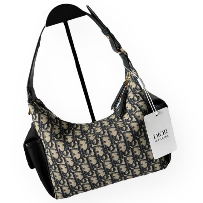 Christian DIOR D-Dream Oblique Beaute Bag & Original Box: • Christian DIOR • D-Dream • Oblique Pattern • Gold Tone Hardware • Dual Side Pockets • Black Accents • Adjustable Strap • Zip Closure • Interior Zip Pocke