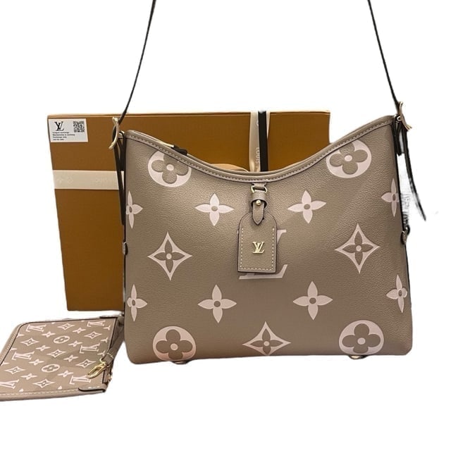 Louis Vuitton Beige/Creme Monogram Carryall Beaute Bag & Original Gift Bag: • Louis Vuitton • Beige • Creme Accents • Monogram Pattern • Carryall • Gold Tone Hardware • Adjustable Strap • Zip Closure • Interior Zip Pocket &bull