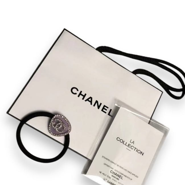 CHANEL Purple/Rhinestone CC Logo Triangle Hair Tie & Gift Bag: • CHANEL • Purple • White Rhinestone Trim • L.A Collection • Hair Tie • Shape: Triangle • Tie Color: Black • White Rhinestone CC Logo • Unopened/In Origina