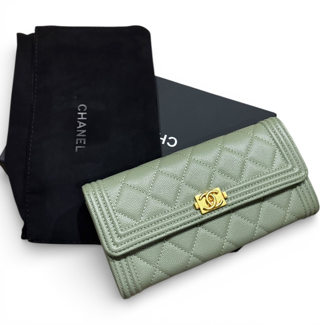 CHANEL Olive/Gold Quilted Le Boy Beaute Wallet & Original Box: • CHANEL • Olive Green • Le Boy Wallet • Gold Tone Hardware • Original Box Included • 2 Gusseted Compartments • Internal Card Slots • Internal Zip Pocket •
