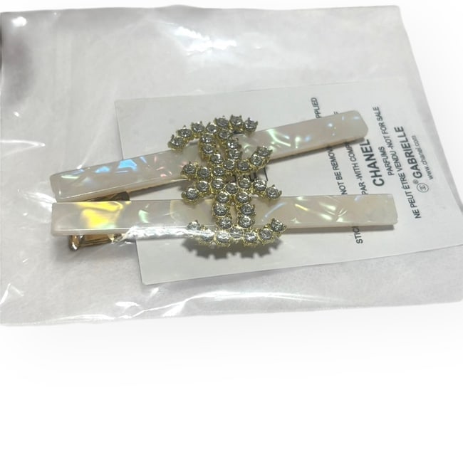 CHANEL 2Pc Set Lg Opal/Rhinestone CC Long Rectangle Hair Clips & Gift Bag: • CHANEL • 2 Pc Set • Hair Clips • Gabrielle • L.A Collection • White Opal • Size: Large • Shape: Lg Long Skinny Rectangle • Gold Tone Hardware • Rhin