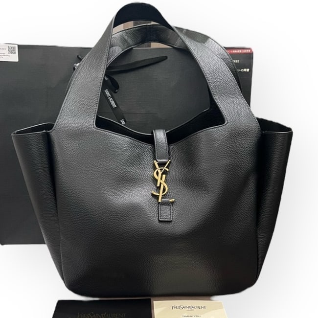 YSL (Saint Laurent) LG Black/Gold Hobo Beaute Bag & Original Gift Bag: • YSL (Saint Laurent) • Black • Hobo • Double Handles • Front YSL Logo Hook Closure • Gold Tone Hardware • Interior Zip Pocket • 12" x 10.6" (in) • Origina
