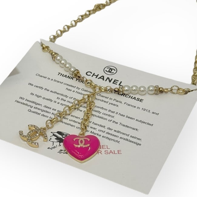 CHANEL 2 Sided Necklace Hot Pink/Rhinestone Covered & Original Gift Bag: • CHANEL • L.A. Collection • Gabrielle • Necklace • Gold Tone Hardware • Adjustable • 2 Sides • Side 1: Hot Pink/Gold CC • Side 2: Pink Rhinestones •