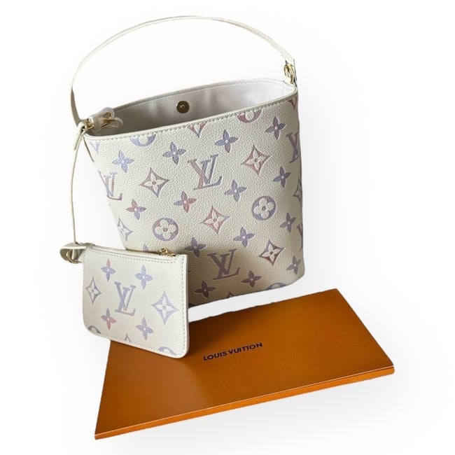 Louis Vuitton Dream Cream All In Beaute BB, Lock/Key, & Original Strap: • Louis Vuitton • All In BB • Bucket Bag • Color: Dream Cream • Monogram Pattern • Gold Tone Hardware • Lock & Key Included • Adjustable Top Handle • Remov