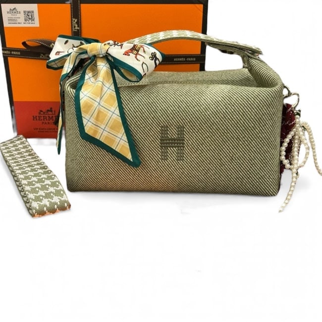 Hermes Green/White Removable Pearl Detailed Bride A Brac Toiletry Beaute Bag: • Hermes • Bride A Brac • Green • White Accents • Silver Tone Hardware • Signature Front H Logo • Removable Pearl/Ribbon Detail • Single Strap • Top Handle