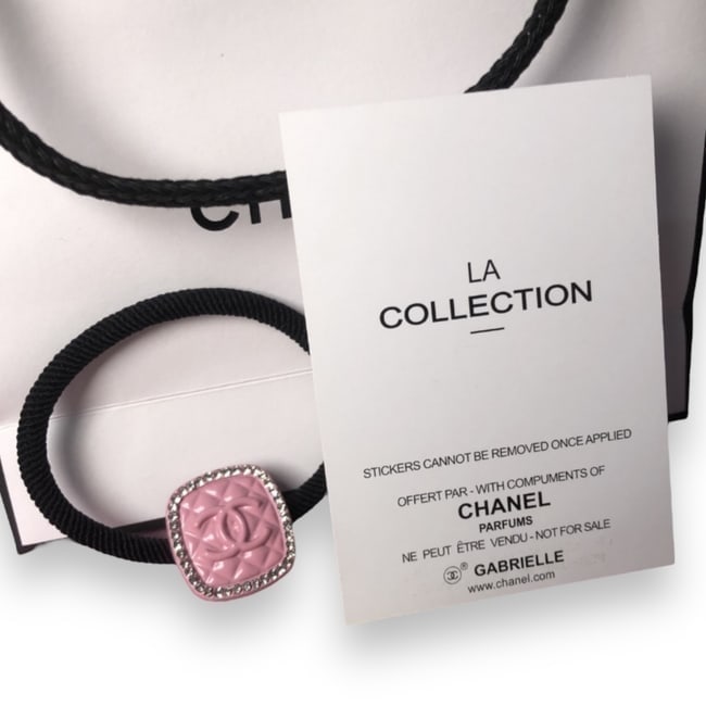 CHANEL Rhinestone Accented CC Baby Pink Hair Tie & Gift Bag: • CHANEL • Baby Pink • Quilted Pattern • L.A Collection • Gabrielle • Hair Tie • Shape: Square • Rhinestone Accented • Front CC Logo • Unopened/In