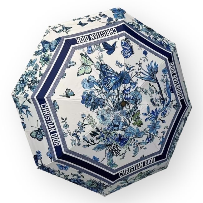 Christian Dior White/Blue Butterfly Print Beaute Umbrella, Storage Sleeve, & Original Box: • Christian Dior • Umbrella • White • Blue Accents • Butterfly Print • Original Storage Sleeve Included • Original Box Included • Box Size: 13.5" x 3" x 3" (in)