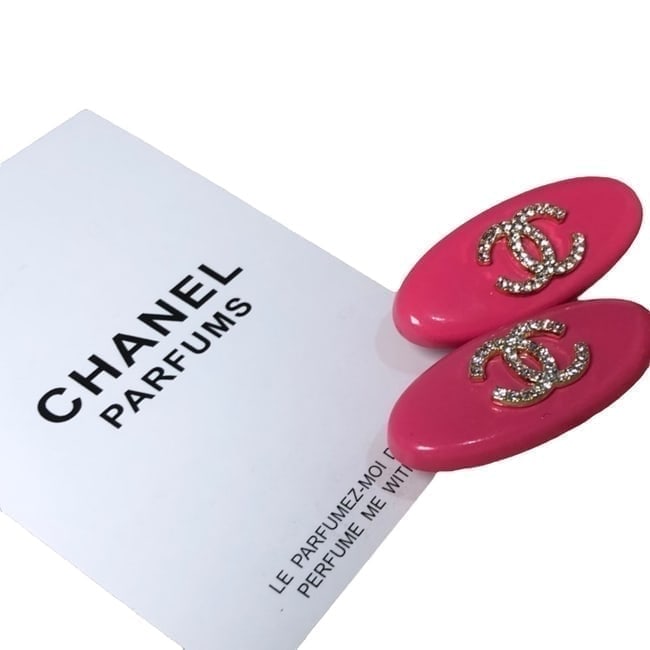 CHANEL 2Pc Lg Hot Pink/White Rhinestone CC Oval Hair Clips & Gift Bag: • CHANEL • Gabrielle • 2Pc Set • Hair Clips • Hot Pink • White Rhinestone CC Logo • Silver Tone Hardware • Shape: Oval • Size: Large • L.A Collection