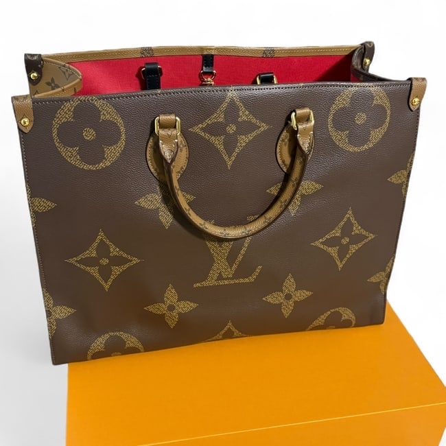 Louis Vuitton Reverse Monogram OnTheGo GM Beaute Tote & Dust Bag Bag: • Louis Vuitton • OnTheGo GM • Tote • Reverse Monogram Print • Red Interior • Double Handles • Removable Strap Included • Gold Tone Hardware • Interior Zip