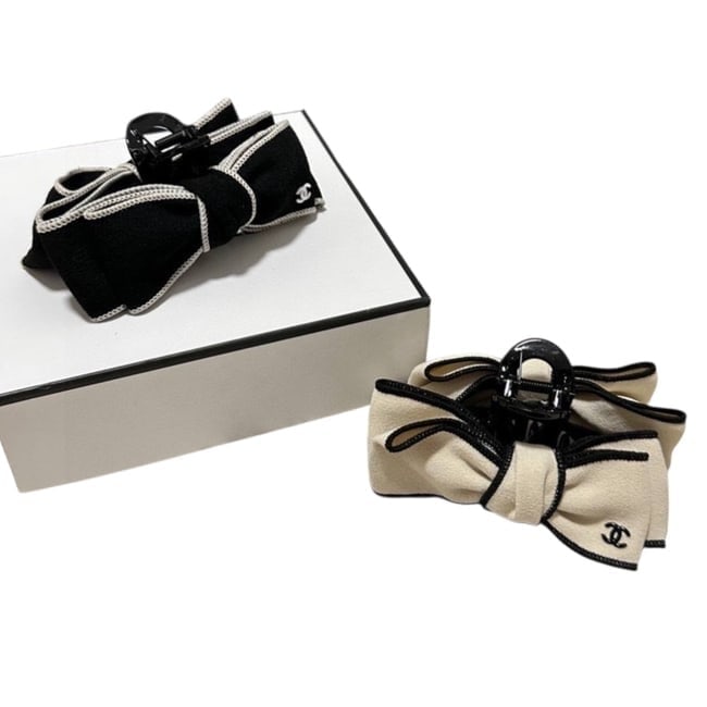 CHANEL 2Pc Black & White Bow Accented Beaute Hair Clips & Original Box: • CHANEL • Type: Hair Clips • Set: 2 Pc Set • Included: 1 Black Hair Clip, 1 White Hair Clip • Size: Large • Feature: Front Logo • Detail: Bow Detail • Packagin