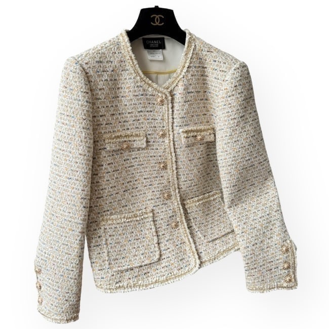 CHANEL White Multi Tweed Button Up/Long Sleeve UL Jacket: • CHANEL • Uniform Line • Tweed Material • White Multicolor • Blazer/Jacket • Button Up • Front Snap Pockets • Long Sleeve • Available in sizes 36, 38, 40,