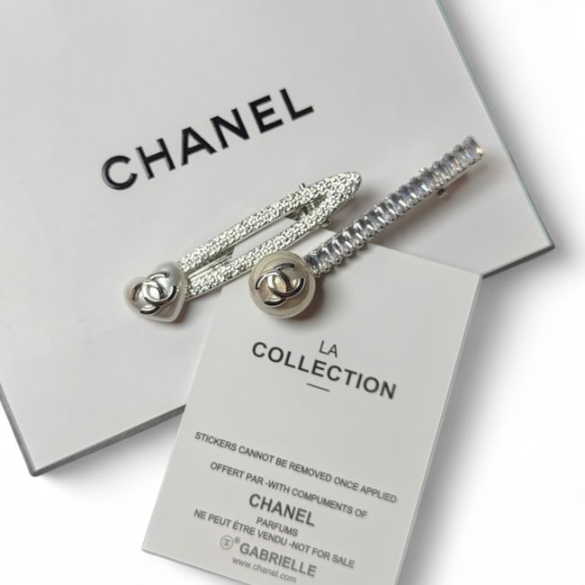 CHANEL2Pc Lg Silver Hair Clips/Heart & Ball Detailed & Original Gift Bag: • CHANEL • L.A. Collection • Gabrielle • 2Pc Set • Hair Clips • Shape1: Heart • Shape 2: Ball • CC Logos • Detailed Designs • Silver Tone Hardware &bu