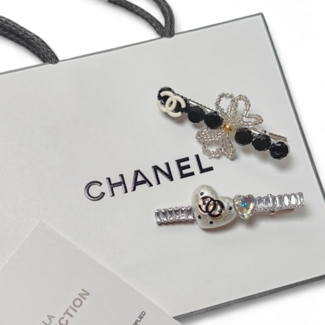 CHANEL2Pc Lg Hair Clips Black & White/Rhinestone Covered & Original Gift Bag: • CHANEL • L.A. Collection • Gabrielle • 2Pc Set • Hair Clips • White & Black Rhinestone Covered • CC Logos • Heart Accents • Rhinestone Covered •