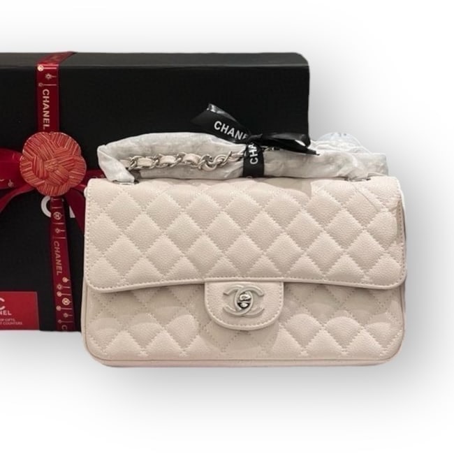 CHANEL Double Flap Medium Creme/Silver Beaute Bag & Original Box: • CHANEL • Creme • Silver Tone Hardware • Double Flap Bag • Quilted Pattern • Exterior Slip Pocket • Signature CC Turn Lock Closure • Intertwined Leather Chain