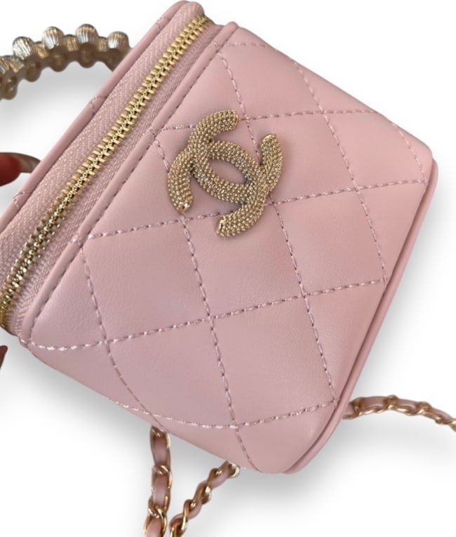 CHANEL Pink Pearl Accented Mini Cube Vanity Beaute Case & Original Box: • CHANEL • Pink • Quilted Pattern • Cube Vanity Case • Gold Tone Hardware • Beveled Front CC Logo • Pearl Accented Top Handle • Intertwined Leather Chain Strap